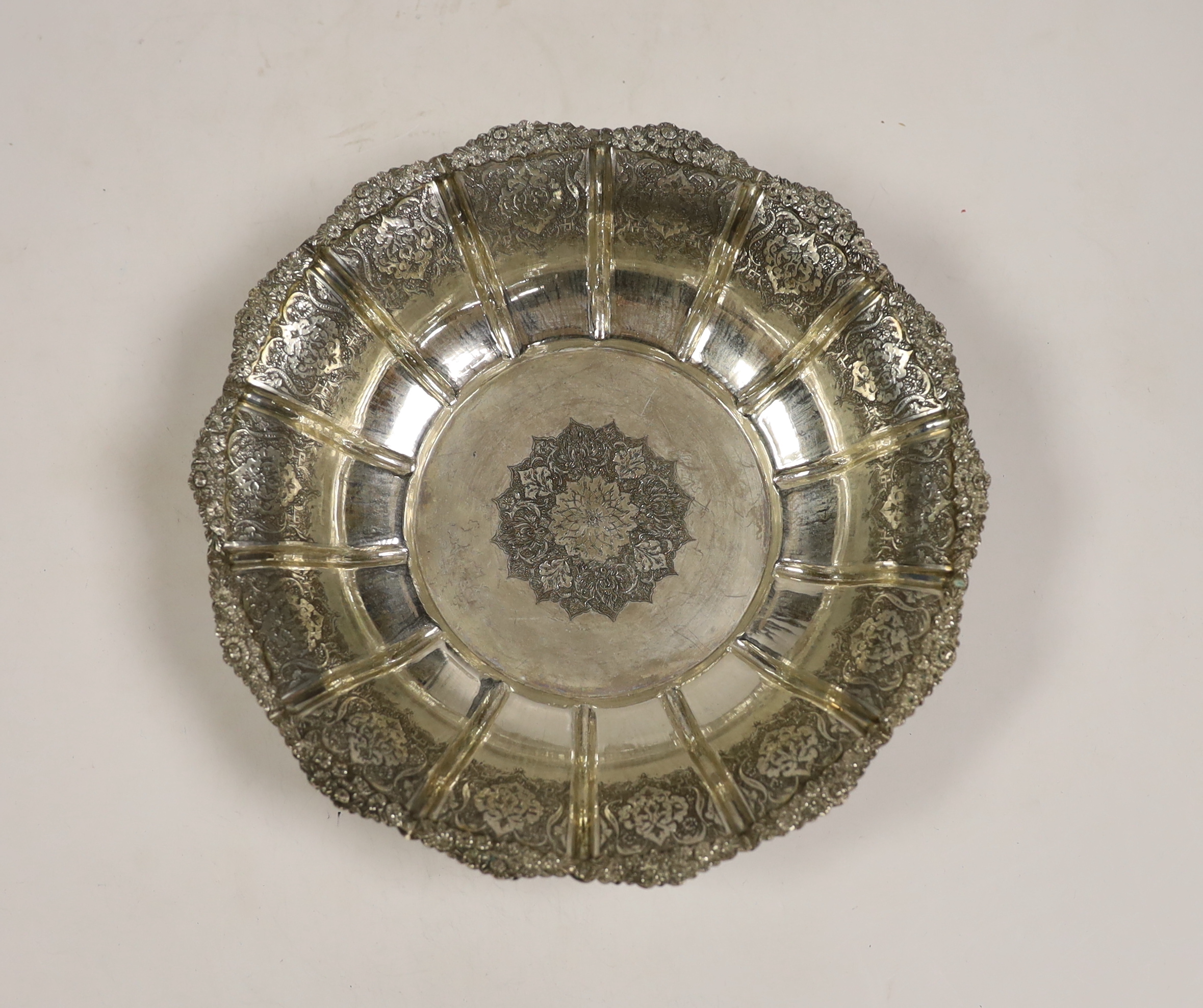 A Persian engraved white metal (stamped 84) fruit bowl, diameter 23cm and a similar pierced dish, 34.4oz.